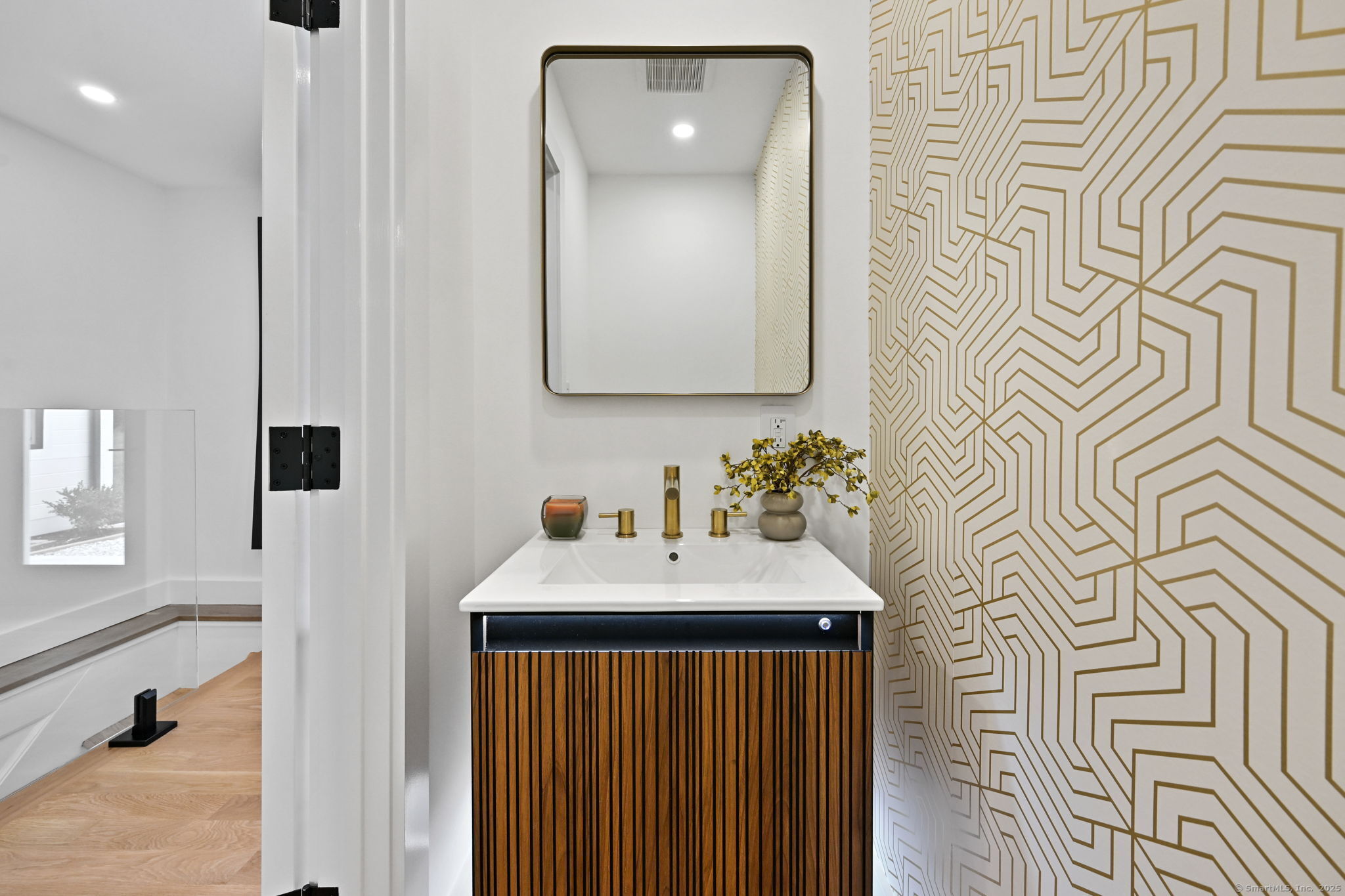 30 Cavalry Road Westport, CT 06880 - Photo 22 of 45 a bathroom with a sink a mirror and a shower