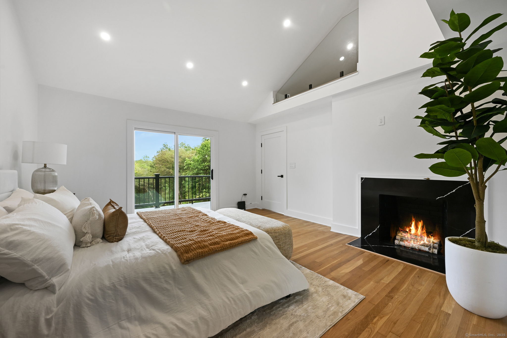 30 Cavalry Road Westport, CT 06880 - Photo 25 of 45 a bedroom with a bed and a fireplace