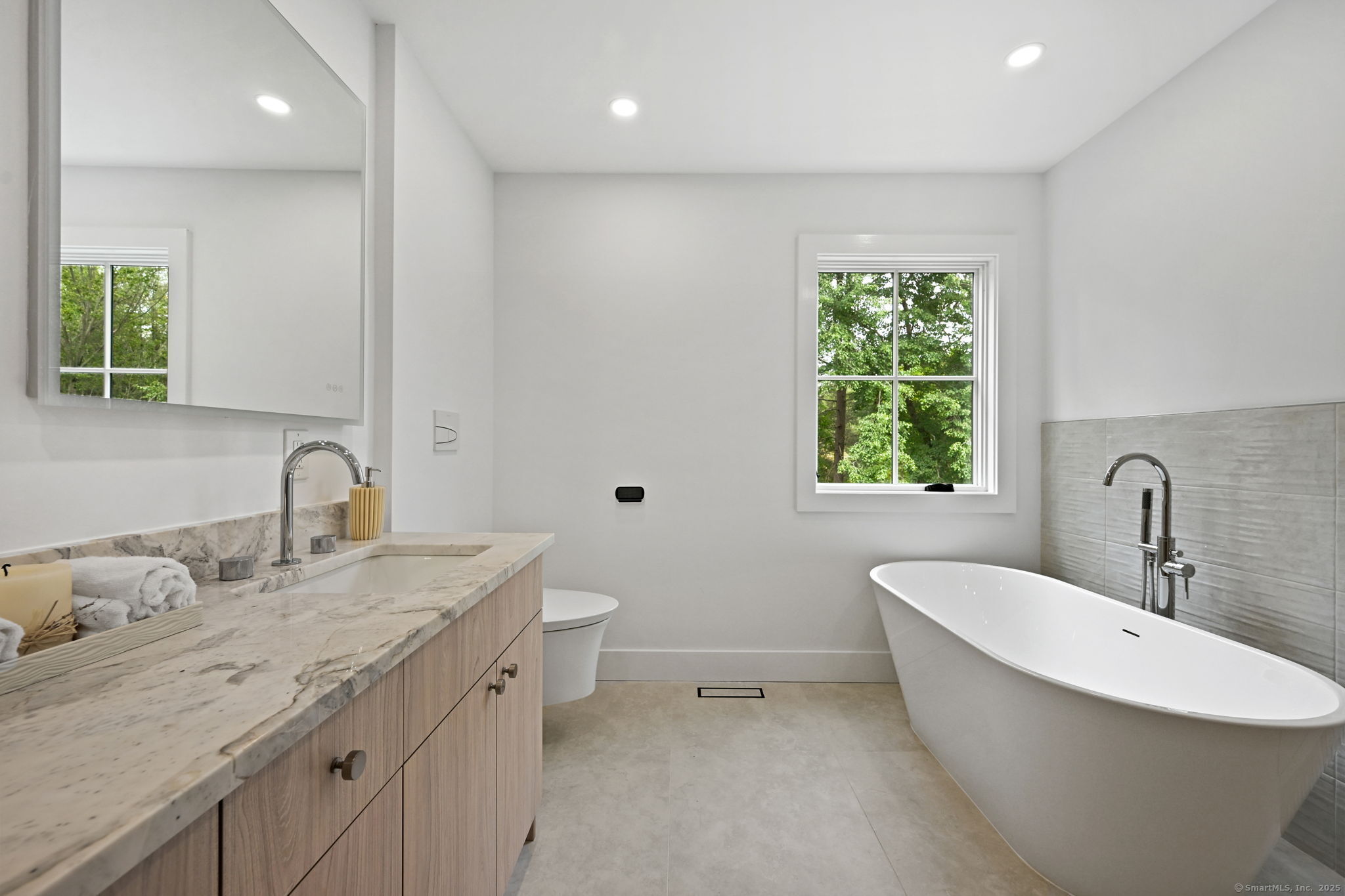 30 Cavalry Road Westport, CT 06880 - Photo 27 of 45 a bathroom with a granite countertop sink a toilet and a bathtub