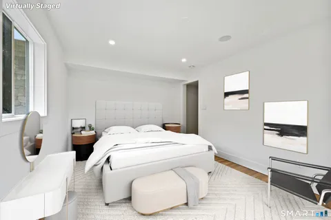 a bed room with two bed and a window