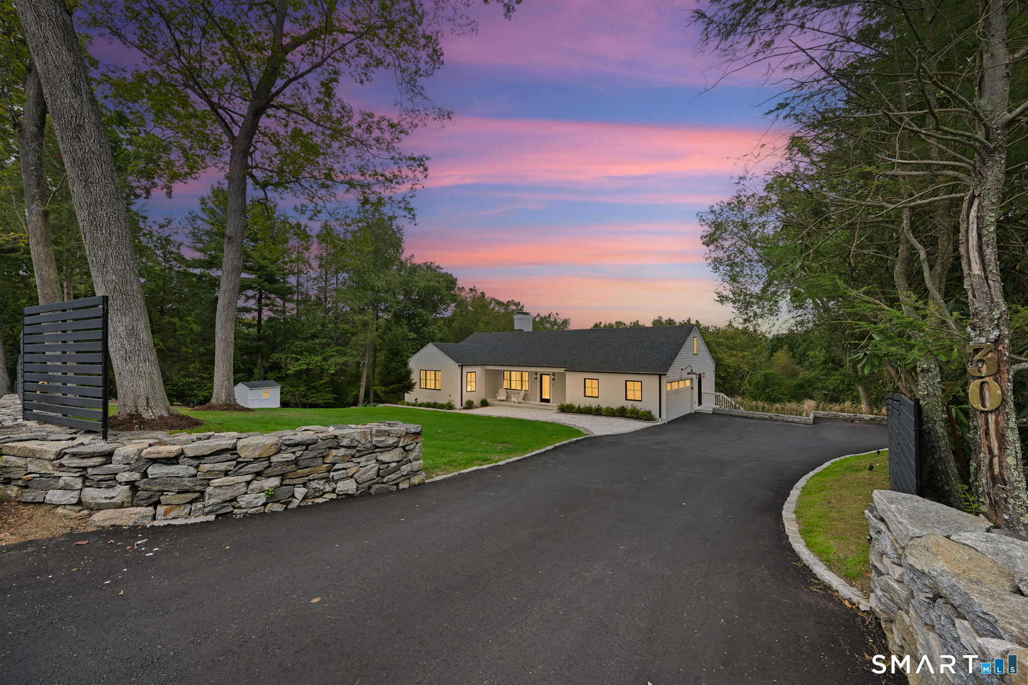 30 Cavalry Road Westport, CT 06880 - Photo 45 of 45 a view of a swimming pool with a yard and wooden fence