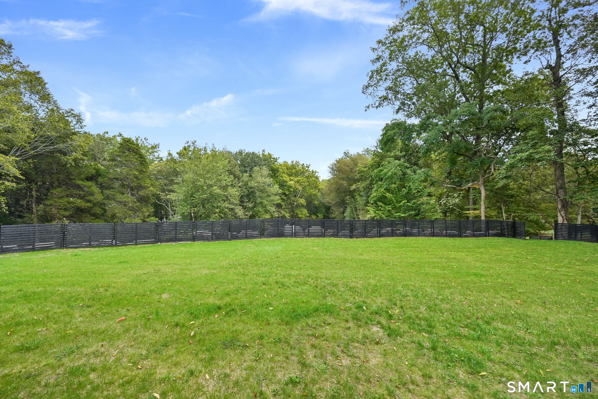 30 Cavalry Road Westport, CT 06880 - Photo 6 of 45 a view of a field with a tree in the background