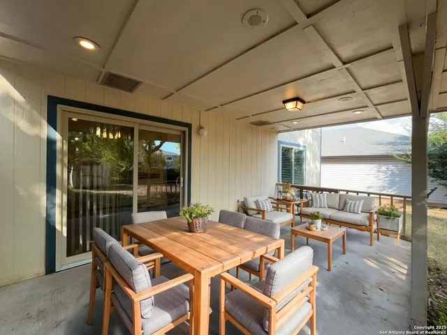 a dinning table and chairs in the patio