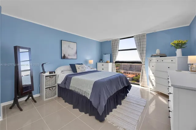 a spacious bedroom with a bed and a couch