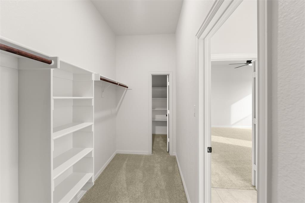125 Snowy Owl Trail Rhome, TX 76078 - Photo 19 of 28 a view of closet area with empty racks