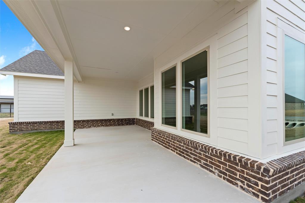 125 Snowy Owl Trail Rhome, TX 76078 - Photo 24 of 28 a view of a balcony with stairs