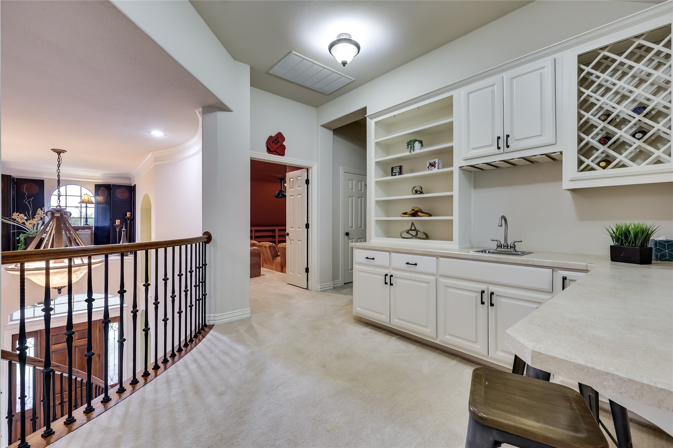 408 Ridgetop Bend Cedar Park, TX 78613 - Photo 30 of 40 A wet bar with ample storage and a built-in wine rack graces this upper-level landing.
