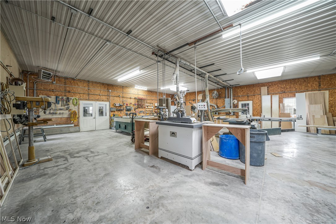 9561 Creaser Road North Bloomfield, OH 44450 - Photo 37 of 45 Garage with a workshop area and a heating unit