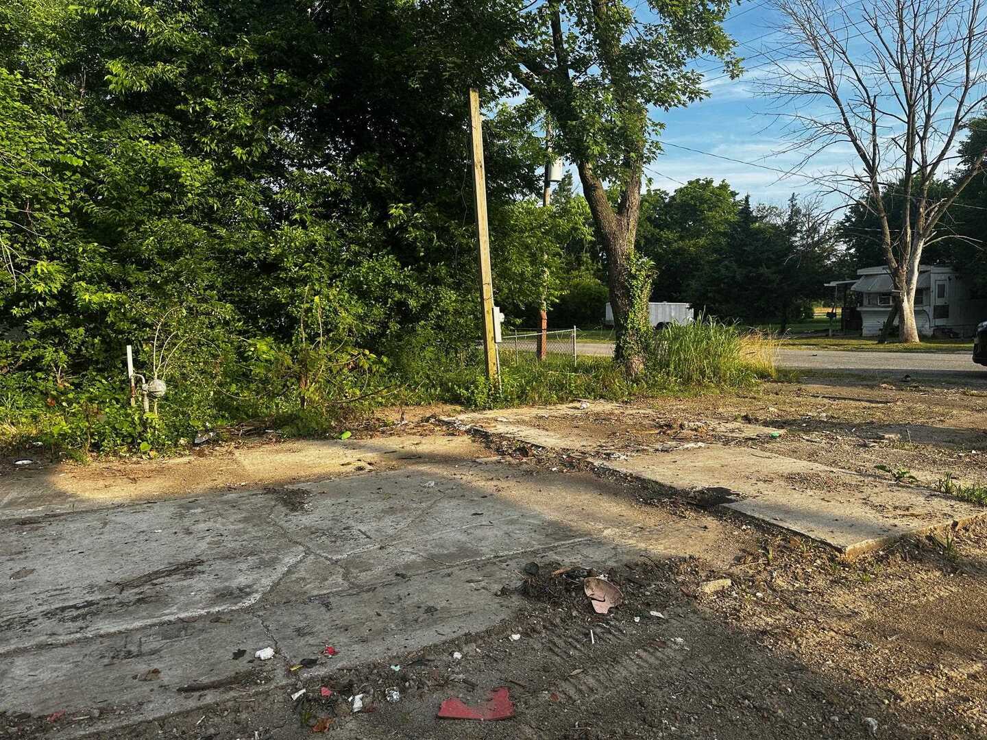 111 Midkiff Street Harrisburg, IL 62946 - Photo 2 of 3 a backyard of a house with lots of green space