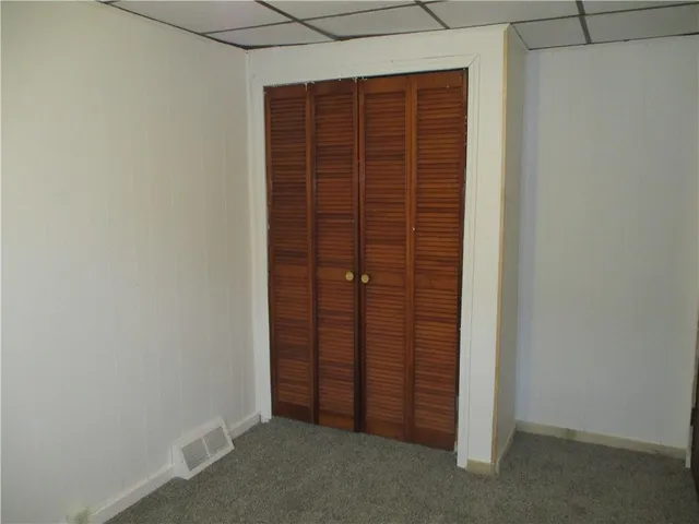 an empty room with a wooden door