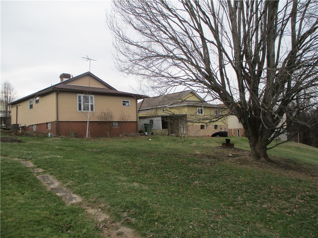 132 Armour Street Richeyville, PA 15358 - Photo 8 of 29 a front view of a house with a garden