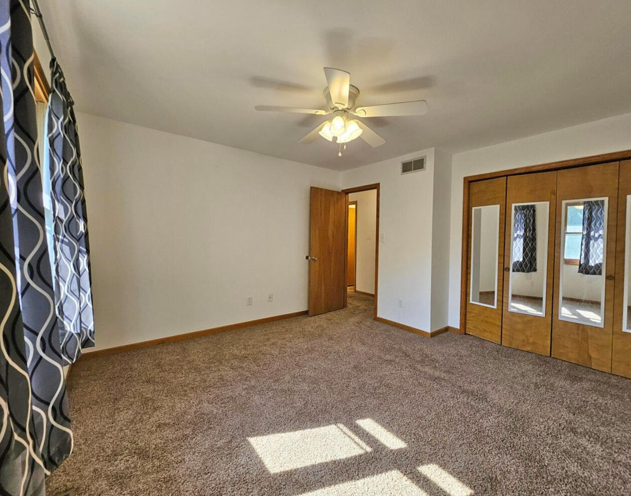 647 North Calumet Road Chesterton, IN 46304 - Photo 18 of 42 an empty room with windows and closet