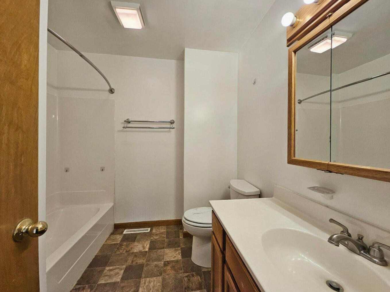 647 North Calumet Road Chesterton, IN 46304 - Photo 21 of 42 a bathroom with a sink a toilet and shower