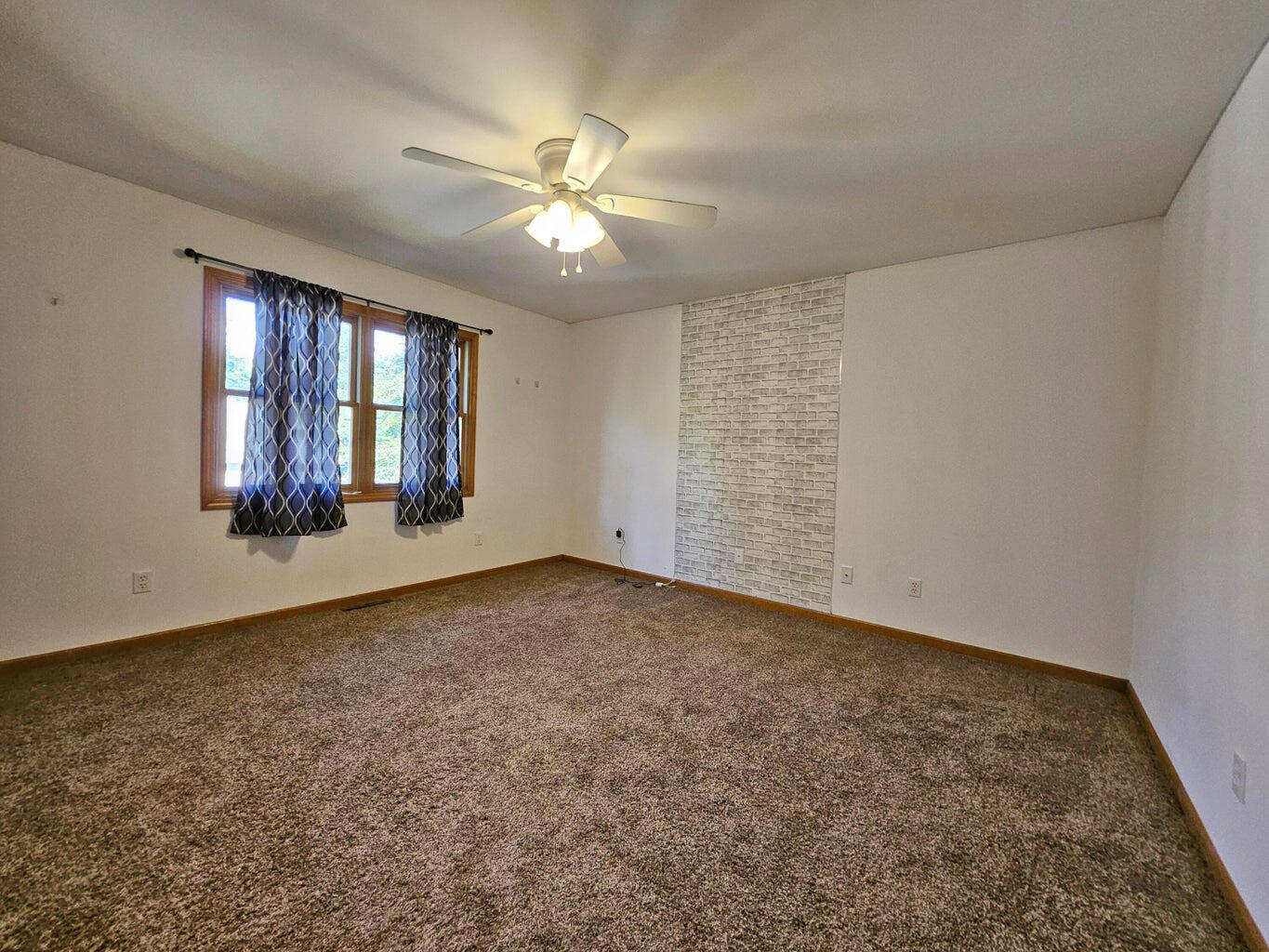 647 North Calumet Road Chesterton, IN 46304 - Photo 22 of 42 an empty room with windows and fan
