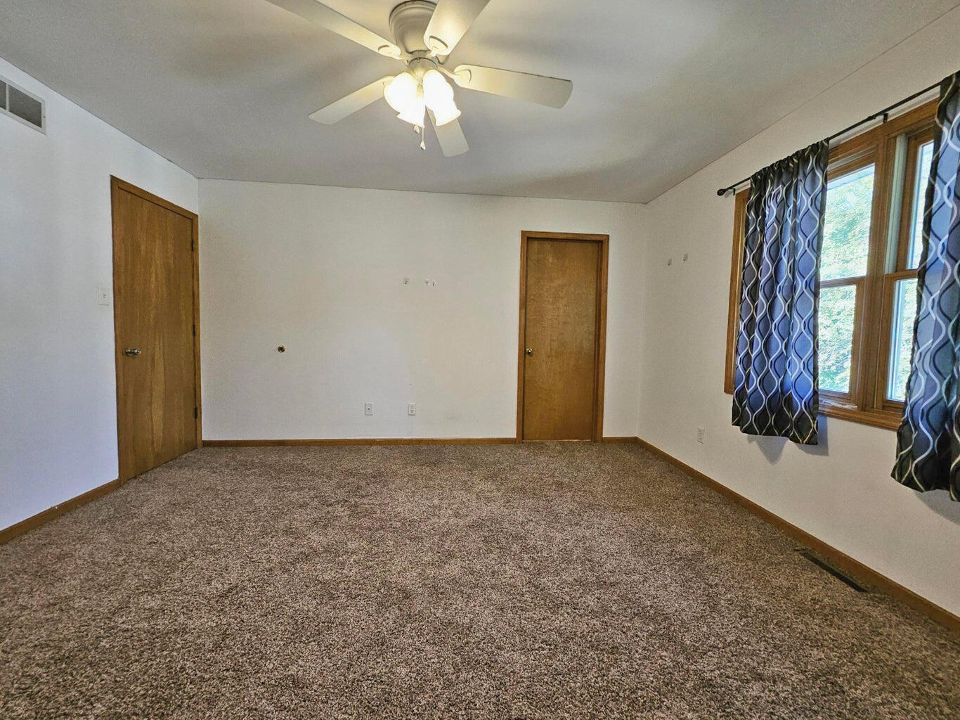 647 North Calumet Road Chesterton, IN 46304 - Photo 24 of 42 a view of an empty room with a window