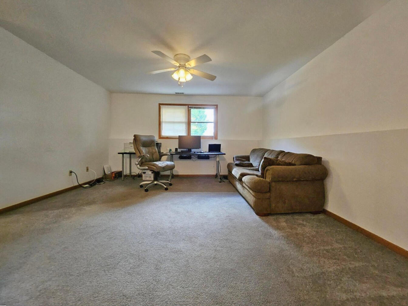647 North Calumet Road Chesterton, IN 46304 - Photo 31 of 42 a living room with furniture and a chandelier