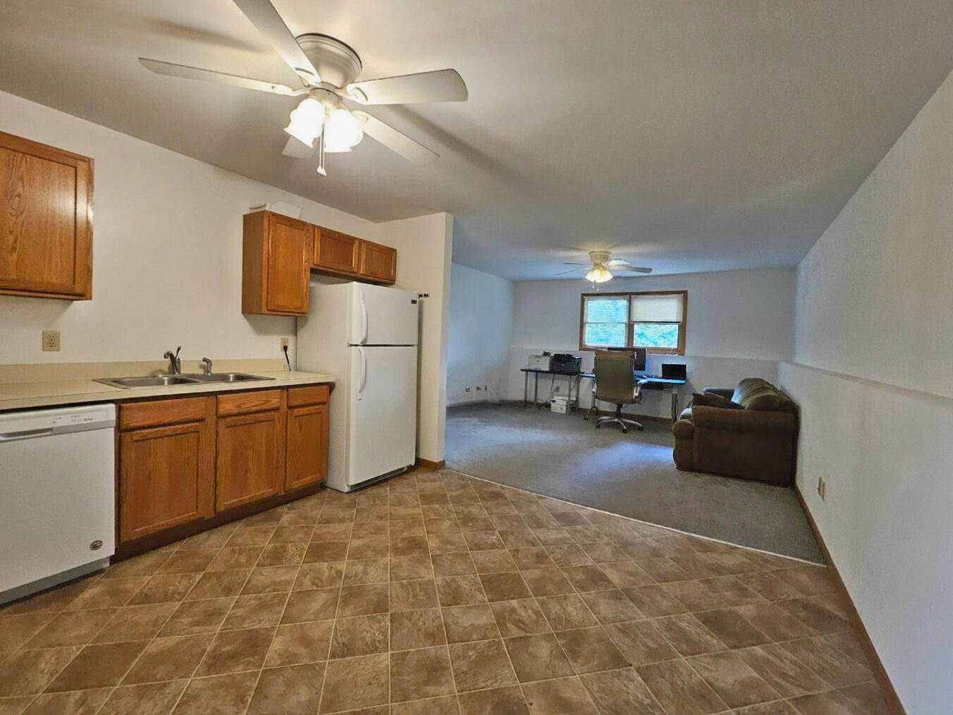 647 North Calumet Road Chesterton, IN 46304 - Photo 34 of 42 a kitchen with furniture and a refrigerator