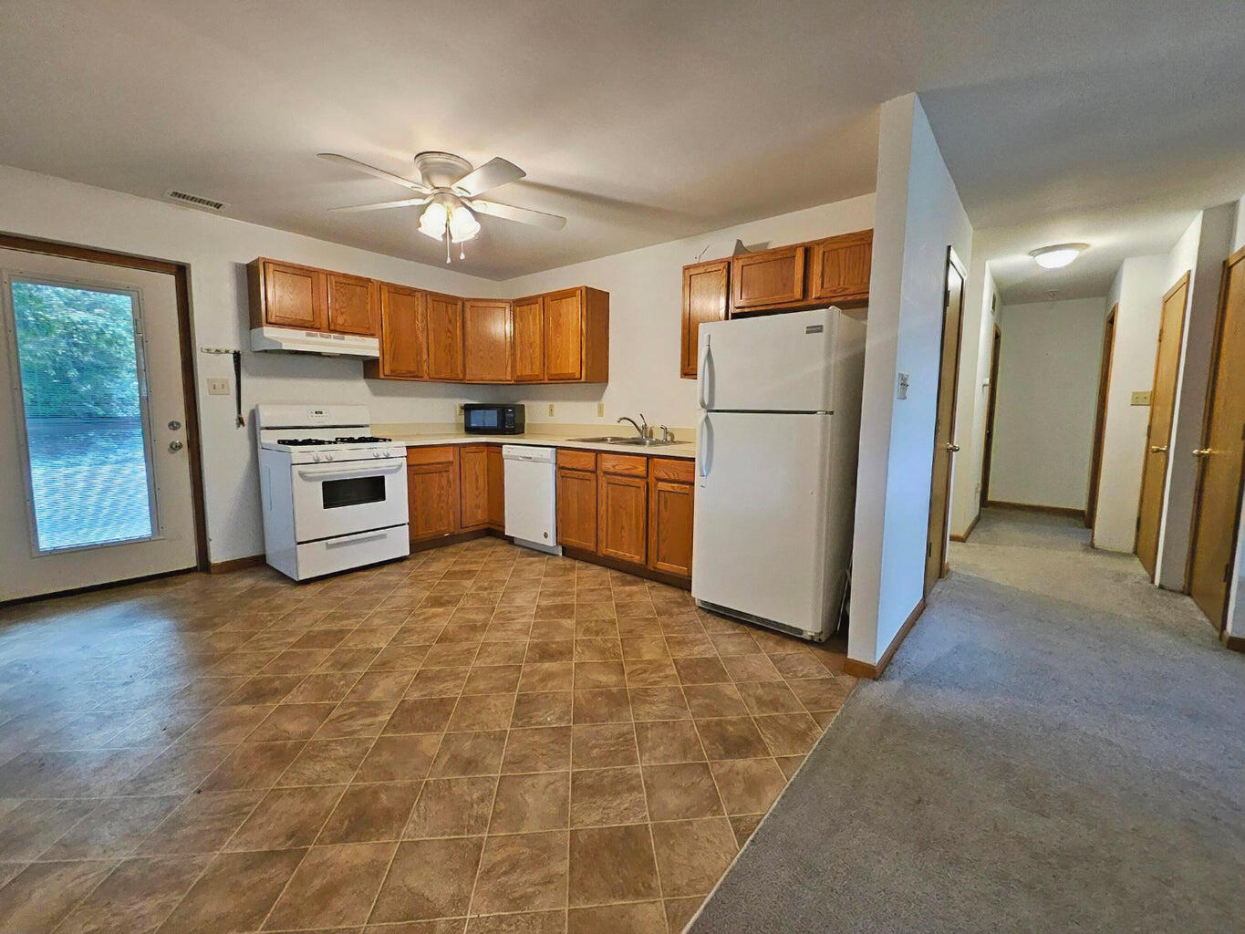 647 North Calumet Road Chesterton, IN 46304 - Photo 36 of 42 a kitchen with a refrigerator and a stove top oven