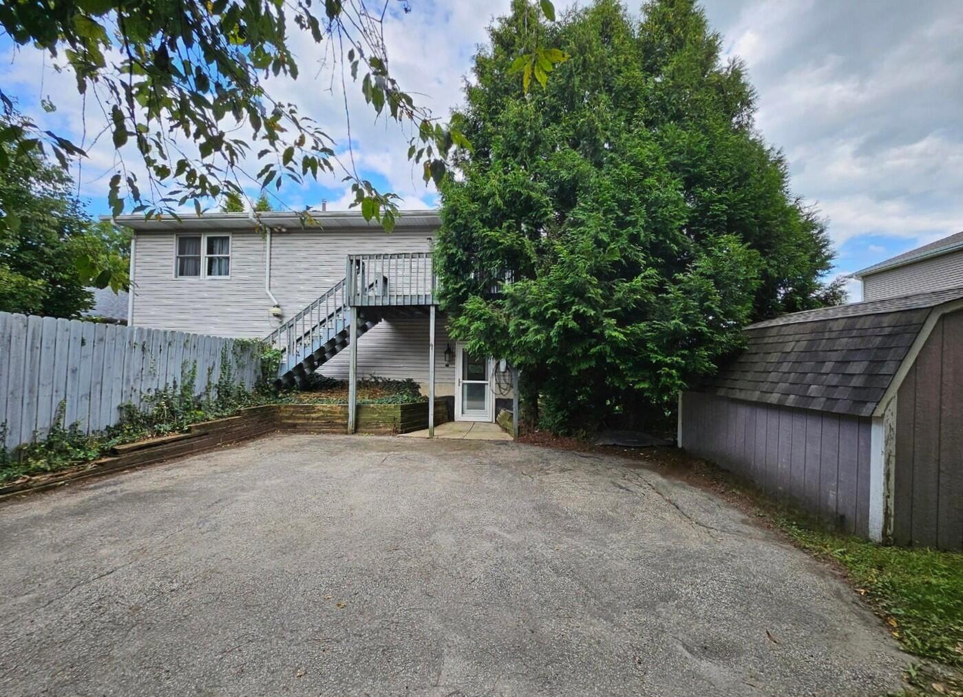 647 North Calumet Road Chesterton, IN 46304 - Photo 4 of 42 front view of a house with a tree