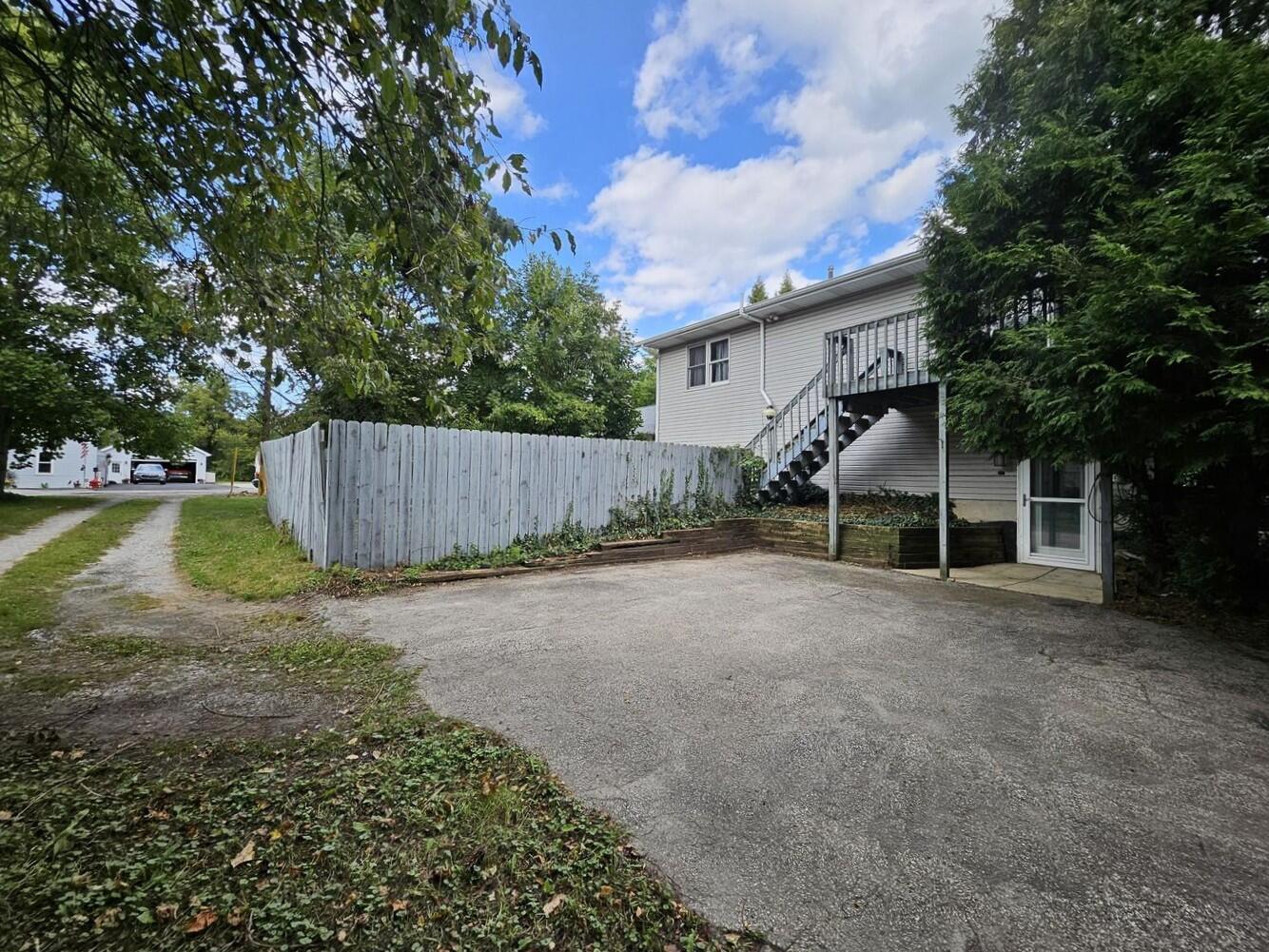 647 North Calumet Road Chesterton, IN 46304 - Photo 5 of 42 a view of a house with backyard and a tree