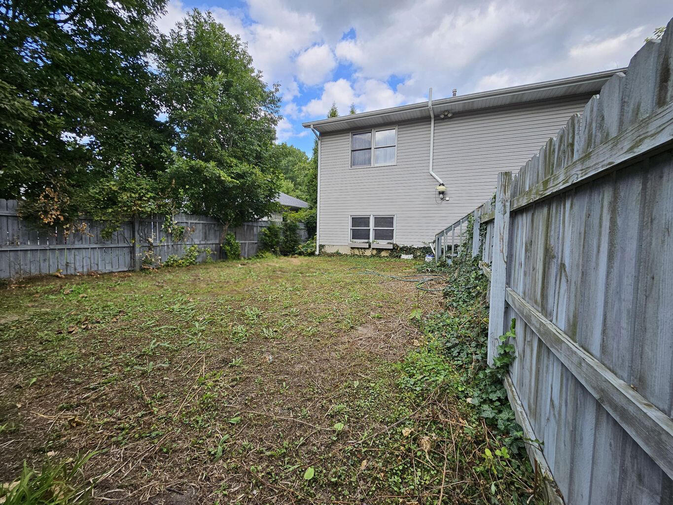 647 North Calumet Road Chesterton, IN 46304 - Photo 7 of 42 a view of a backyard with a large tree