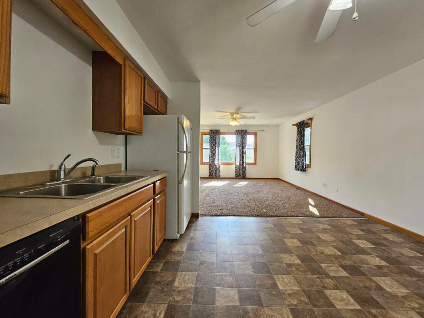 647 North Calumet Road Chesterton, IN 46304 - Photo 8 of 42 a kitchen with stainless steel appliances granite countertop a sink stove and cabinets