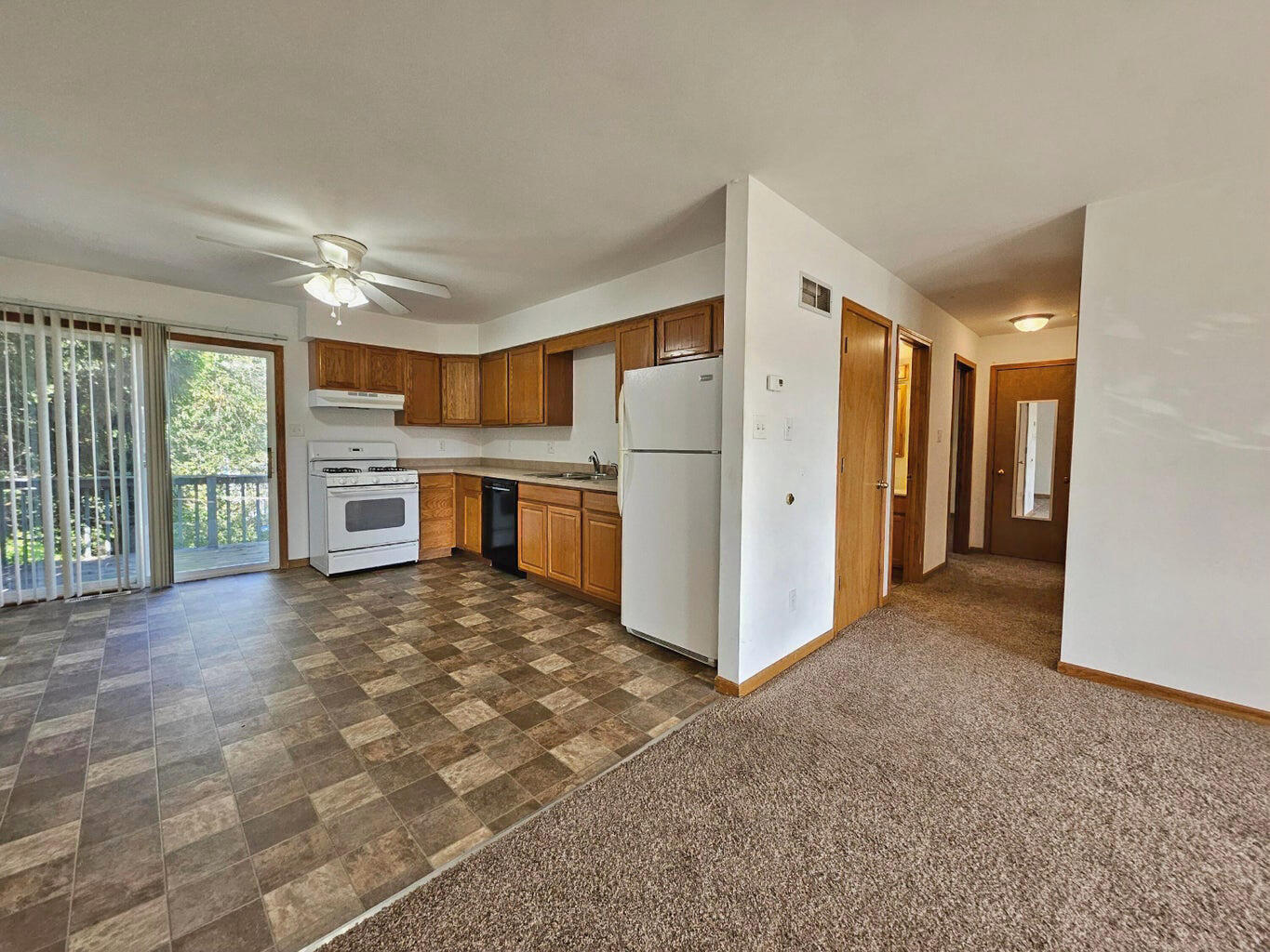 647 North Calumet Road Chesterton, IN 46304 - Photo 10 of 42 a view of a kitchen with a sink and a refrigerator