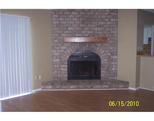 a stone fireplace with a fireplace