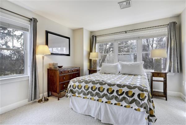 11 Whitney Street, Unit 11 Brookline, MA 02467 - Photo 13 of 20 a bedroom with a bed and a window