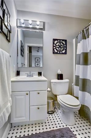 11 Whitney Street, Unit 11 Brookline, MA 02467 - Photo 14 of 20 a bathroom with a sink a toilet and a mirror
