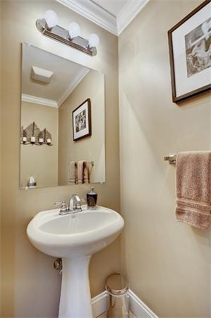 11 Whitney Street, Unit 11 Brookline, MA 02467 - Photo 16 of 20 a bathroom with a sink and a mirror