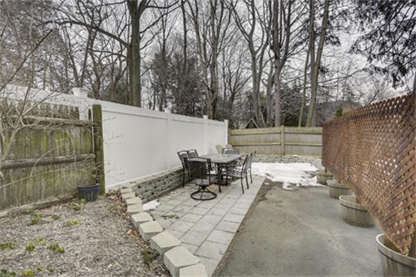 11 Whitney Street, Unit 11 Brookline, MA 02467 - Photo 20 of 20 a view of a patio with table and chairs and floor to ceiling window