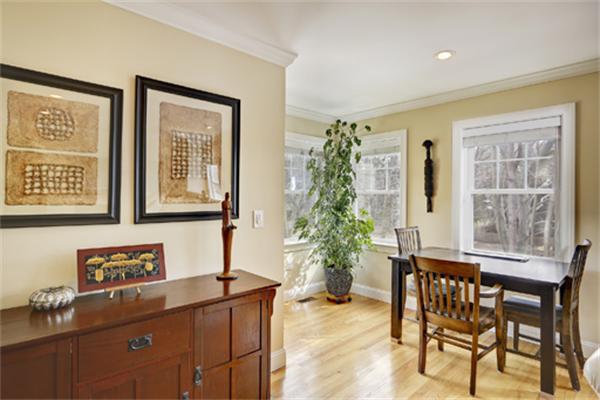 11 Whitney Street, Unit 11 Brookline, MA 02467 - Photo 6 of 20 a view of a dining room with furniture and a potted plant