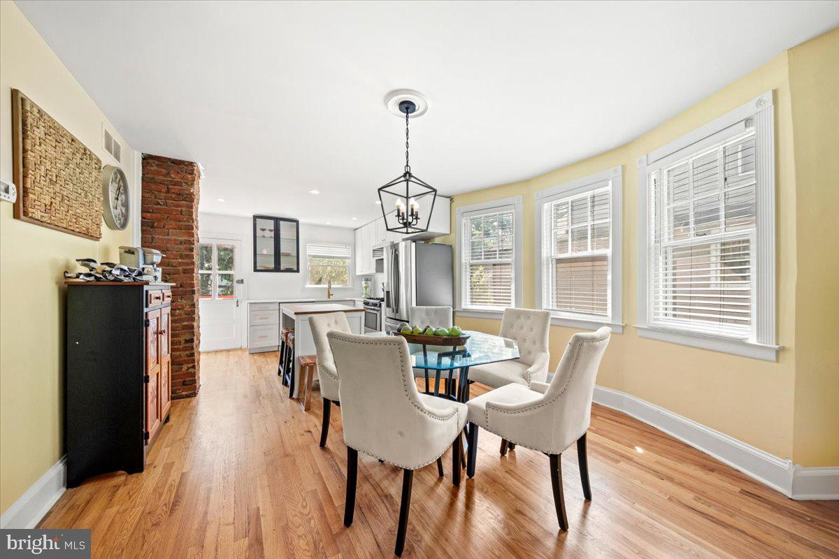 313 Fairview Avenue Moorestown, NJ 08057 - Photo 11 of 47 a dining room with furniture a chandelier and wooden floor