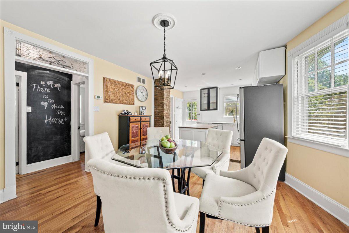 313 Fairview Avenue Moorestown, NJ 08057 - Photo 12 of 47 a dining room with furniture a chandelier and wooden floor