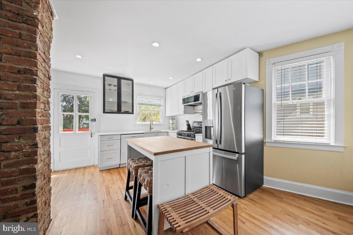 313 Fairview Avenue Moorestown, NJ 08057 - Photo 13 of 47 a kitchen with stainless steel appliances a refrigerator and a stove top oven