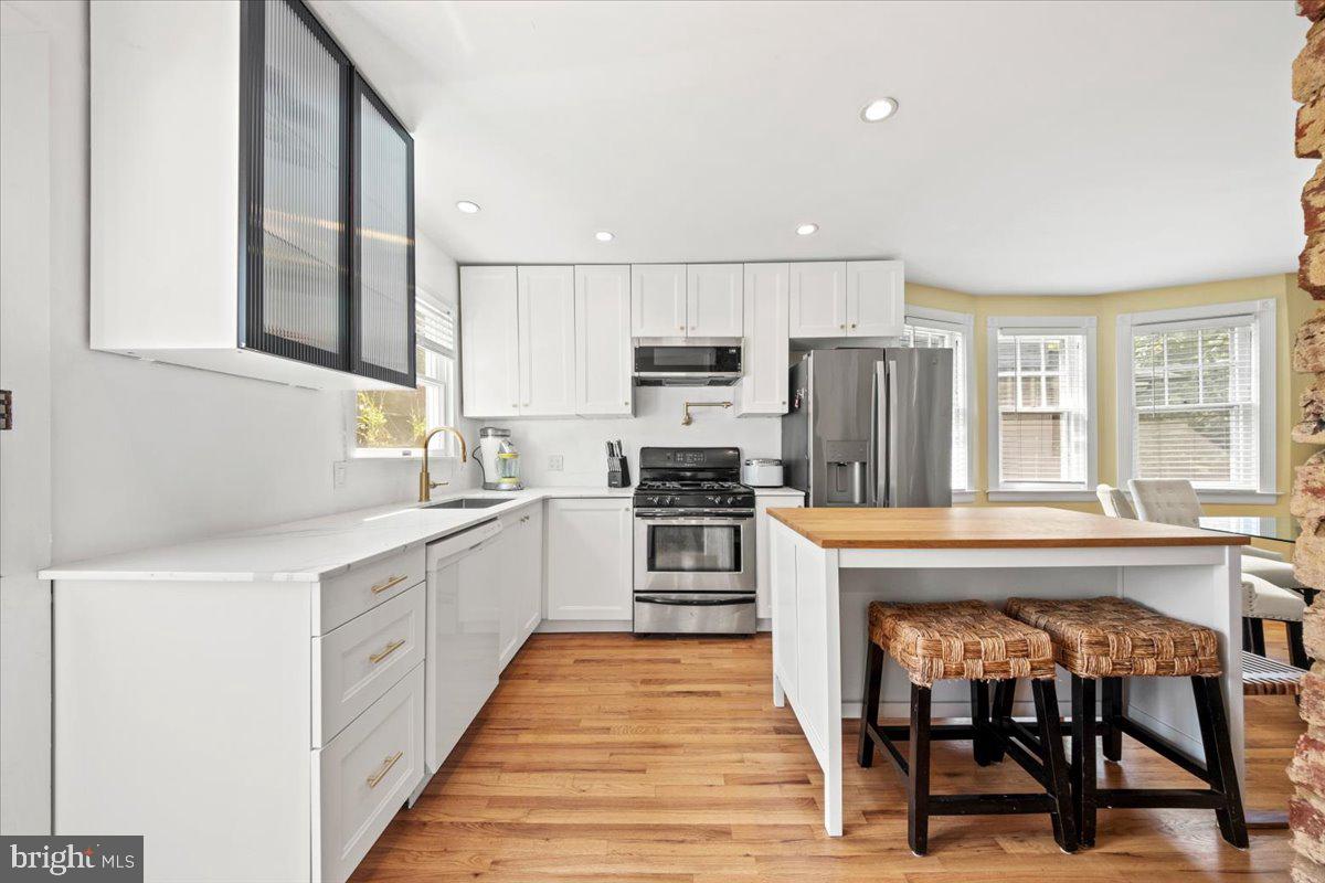 313 Fairview Avenue Moorestown, NJ 08057 - Photo 15 of 47 a open kitchen with stainless steel appliances granite countertop a stove top oven a sink dishwasher and a refrigerator