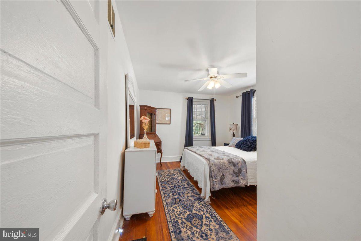 313 Fairview Avenue Moorestown, NJ 08057 - Photo 17 of 47 a bedroom with a bed and a chandelier