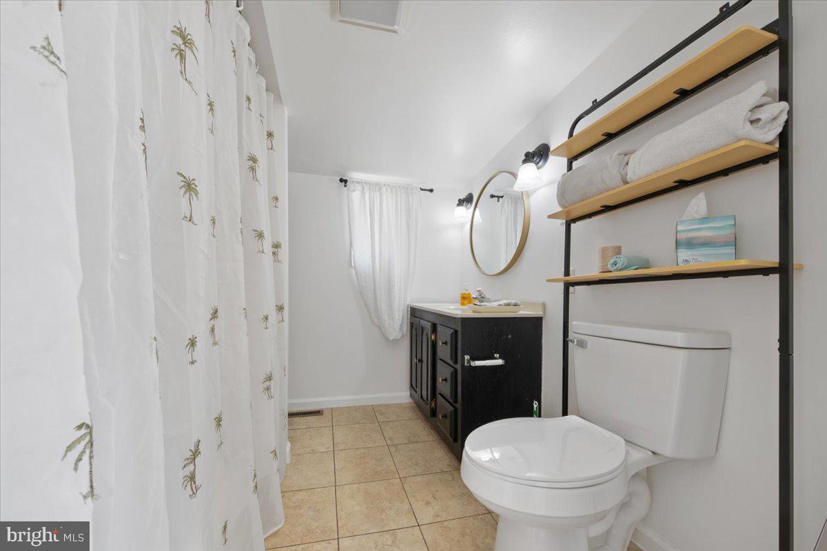 313 Fairview Avenue Moorestown, NJ 08057 - Photo 29 of 47 a bathroom with a toilet sink and mirror