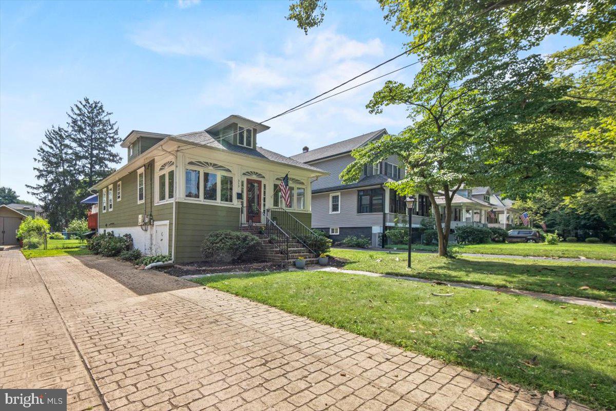 313 Fairview Avenue Moorestown, NJ 08057 - Photo 3 of 47 a front view of a house with a yard