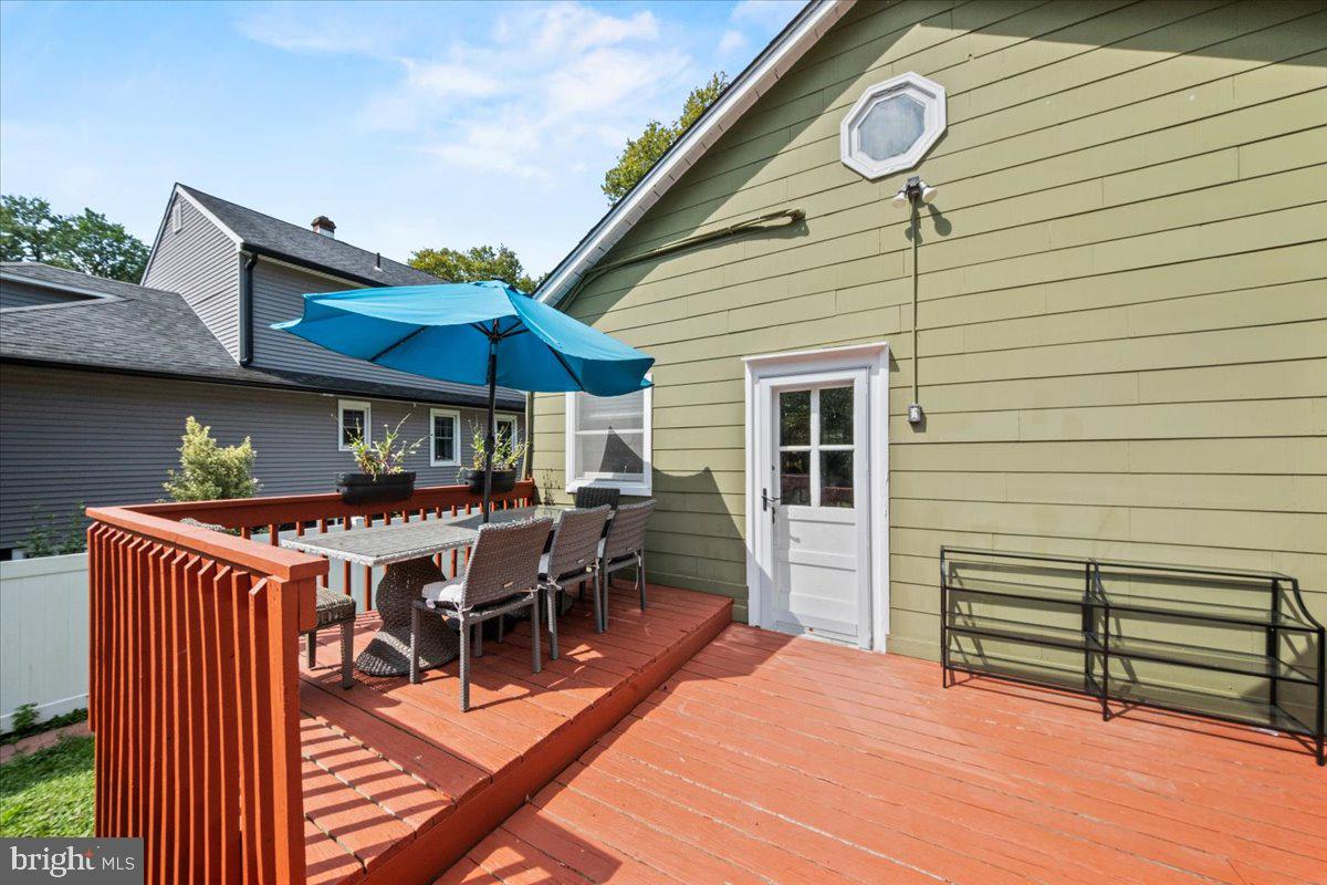 313 Fairview Avenue Moorestown, NJ 08057 - Photo 40 of 47 a view of a patio with table and chairs under an umbrella