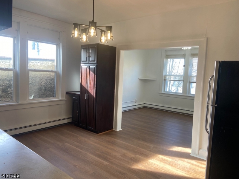 126 Main Street, Unit E Franklin, NJ 07416 - Photo 1 of 7 a view of empty room with wooden floor and fan