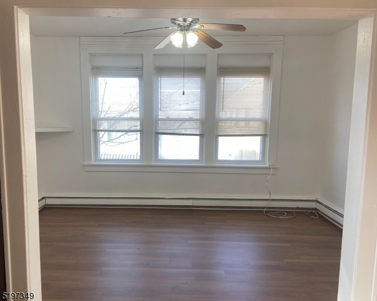 126 Main Street, Unit E Franklin, NJ 07416 - Photo 3 of 7 wooden floor in an empty room with a window