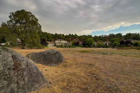 an aerial view of a houses with outdoor space