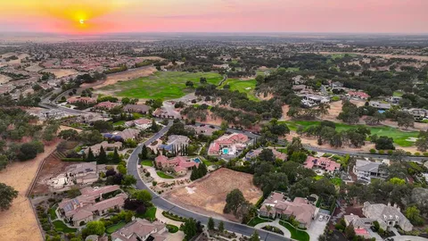 an aerial view of residential building with parking space