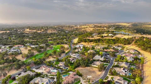 an aerial view of residential building and lake