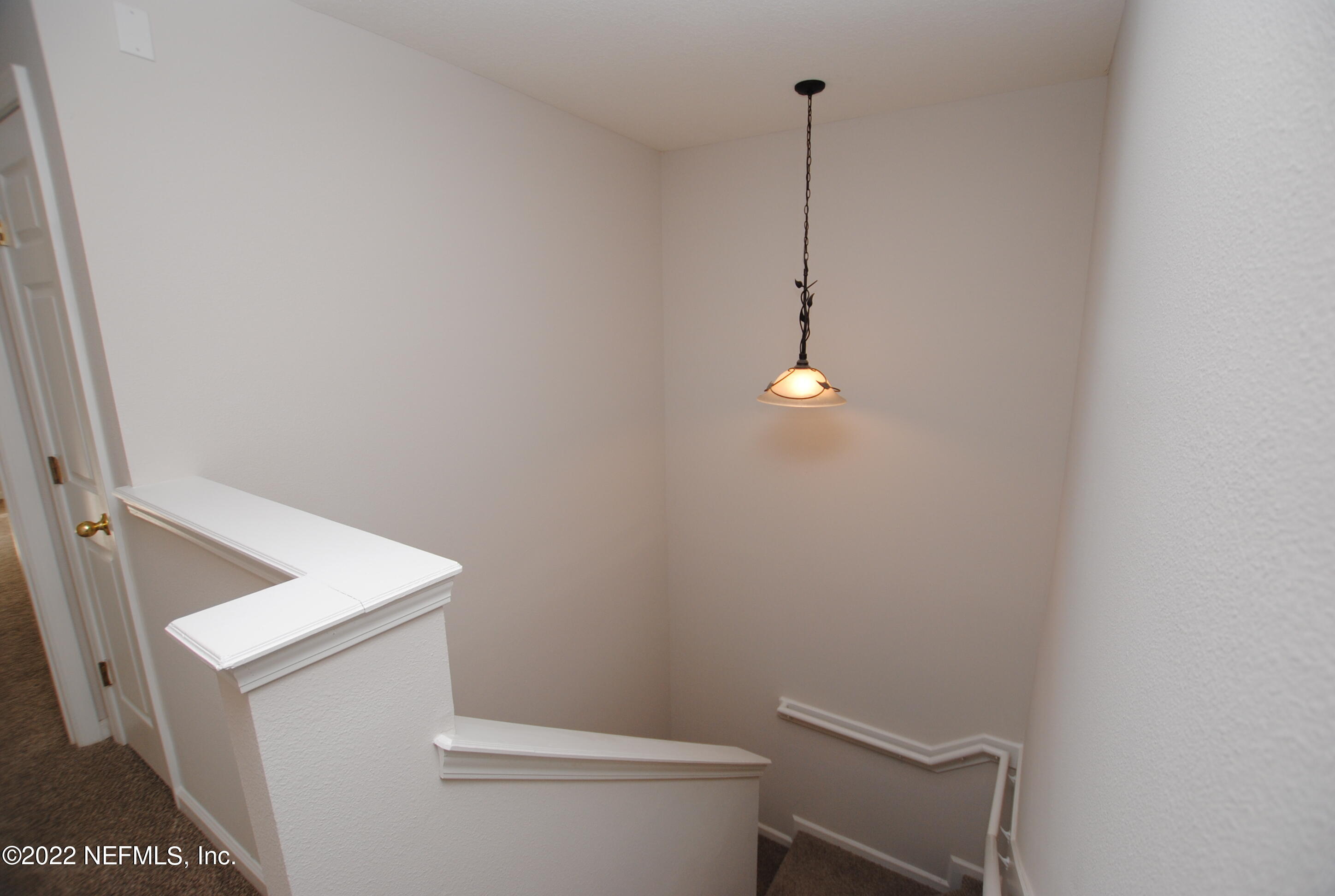 5260 Collins Road, Unit 505 Jacksonville, FL 32244 - Photo 11 of 20 a bathroom with a sink a toilet and vanity