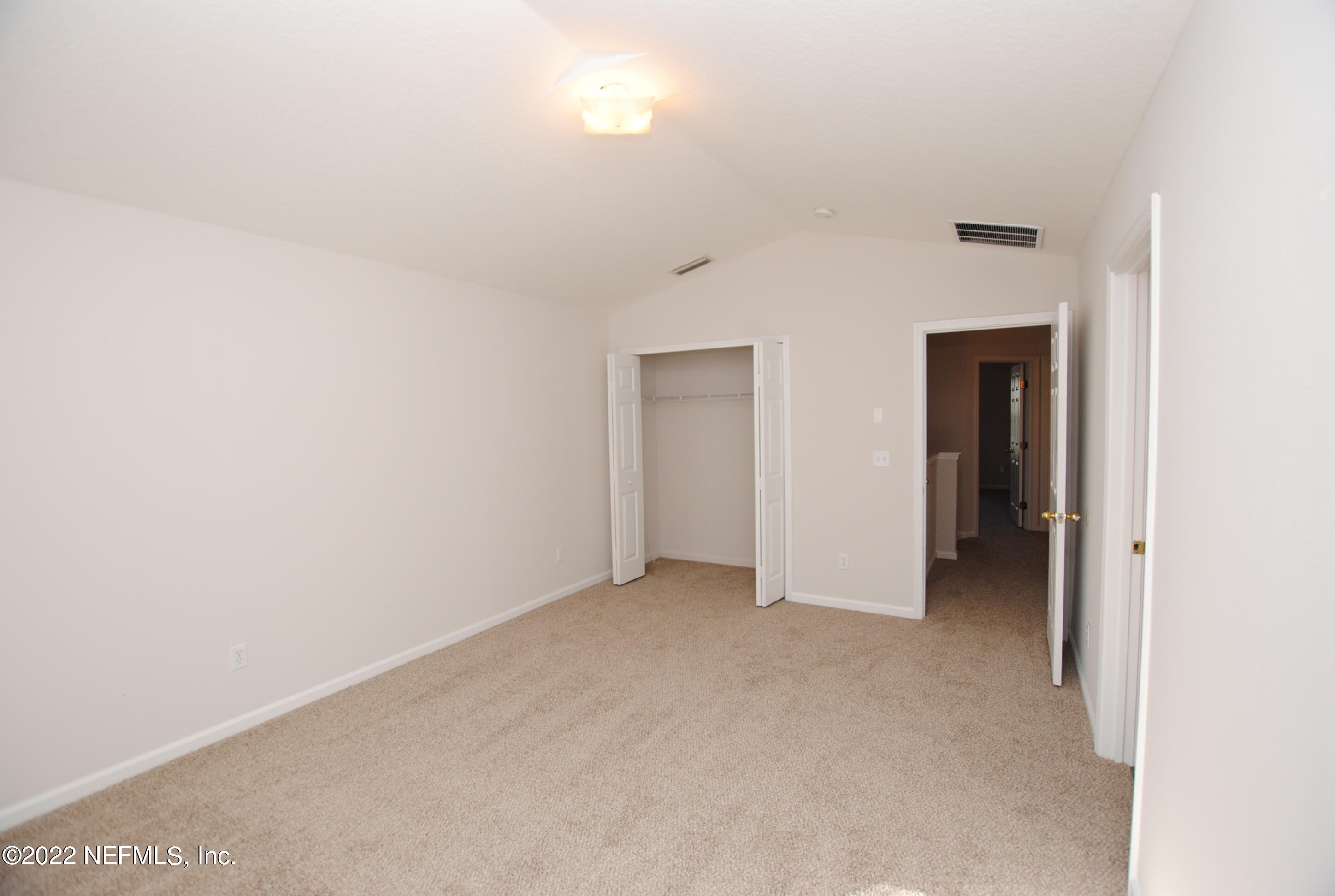 5260 Collins Road, Unit 505 Jacksonville, FL 32244 - Photo 13 of 20 a view of an empty room and closet