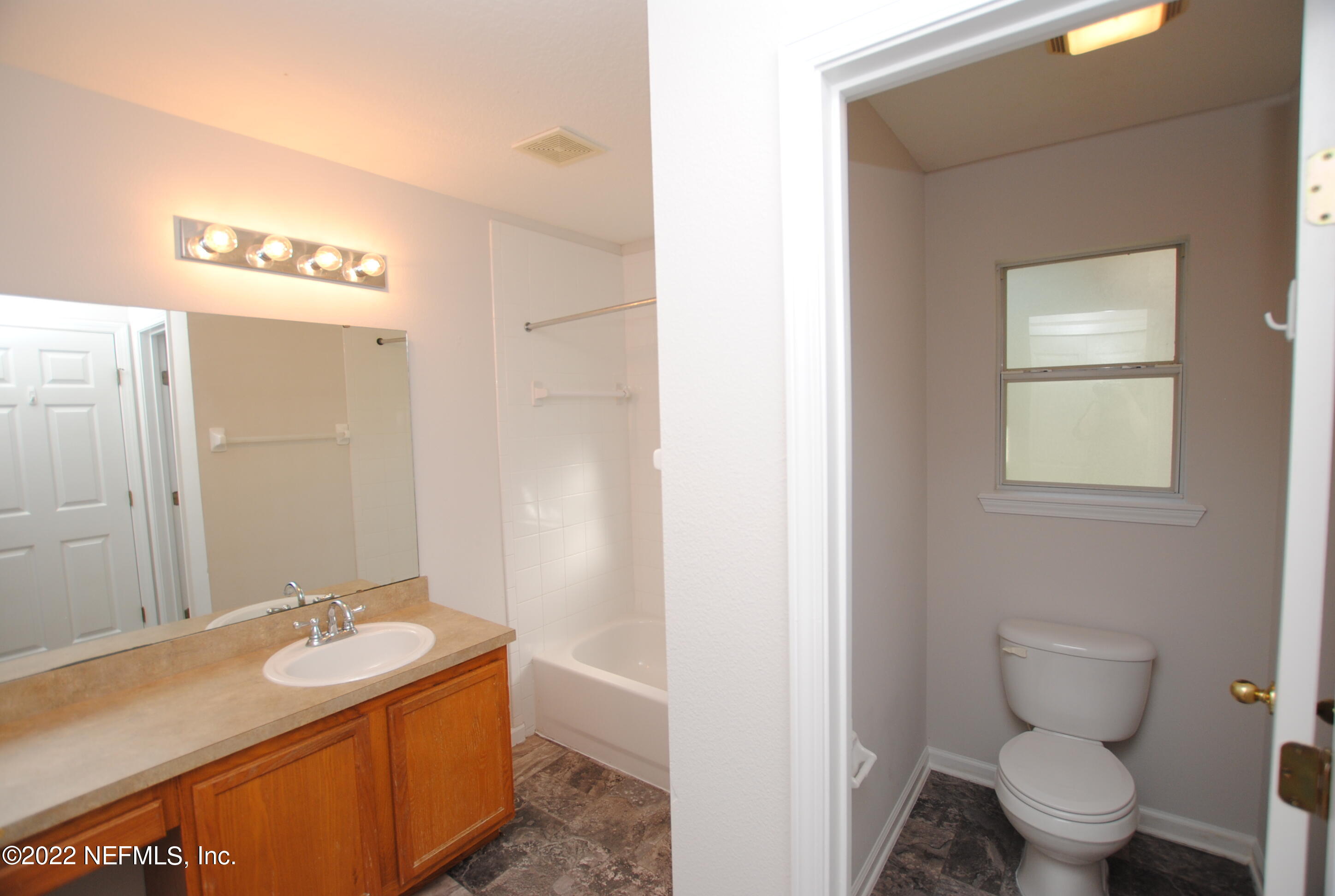 5260 Collins Road, Unit 505 Jacksonville, FL 32244 - Photo 15 of 20 a bathroom with a sink and a toilet