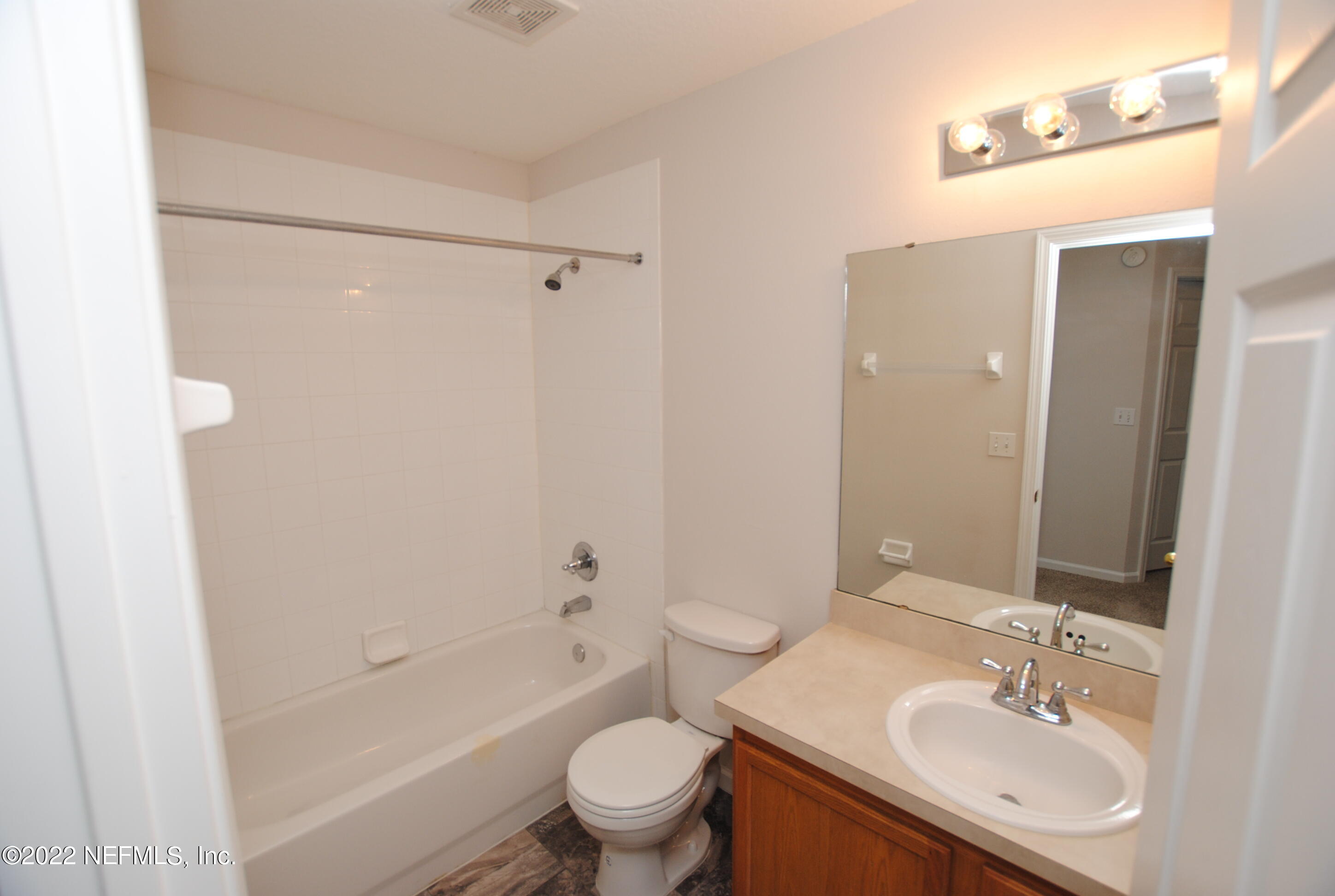 5260 Collins Road, Unit 505 Jacksonville, FL 32244 - Photo 18 of 20 a bathroom with a sink toilet and shower
